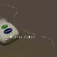 Dental tape/floss REMOVING DEBRIS WITH DENTAL FLOSS