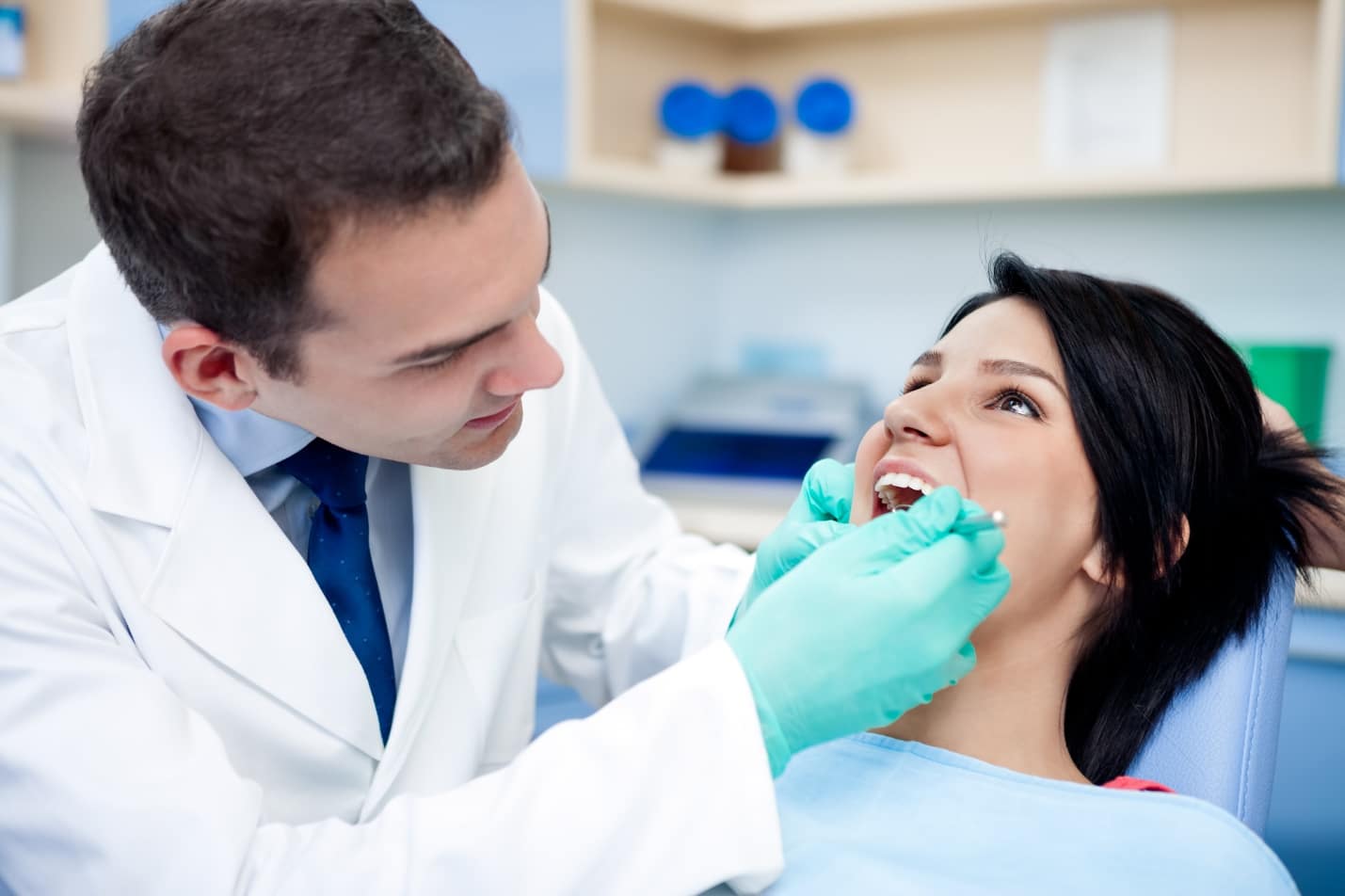 A doctor examining a patient Description automatically generated with low confidence