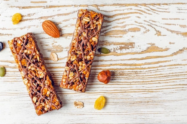 Healthy delicios granola bars with chocolate, muesli bars with nuts and dry fruits, top view Free Photo