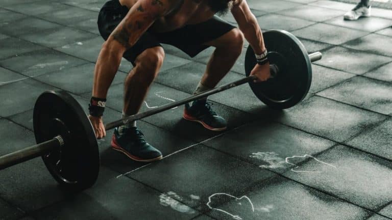 A person lifting weights Description automatically generated with medium confidence