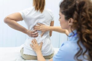 physiotherapist doing healing treatment womans back back pain patient treatment medical doctor massage therapistoffice syndrome 657921 323